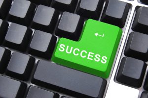 online business concept with success butten on computer keyboard
